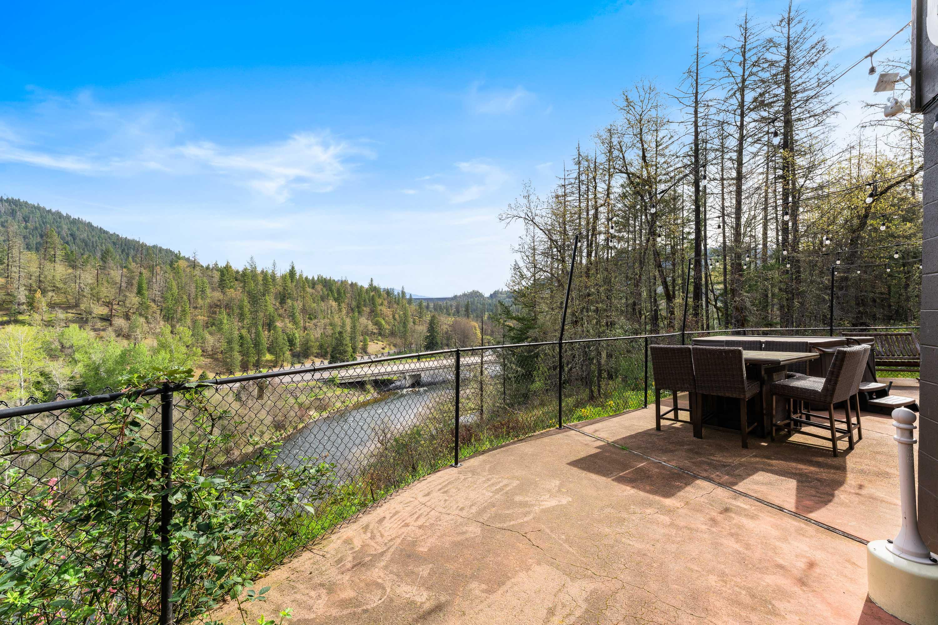 7201 Crowfoot Road Trail, OR 97541 - Photo 38 of 56 a view of a lake with a bench in the background