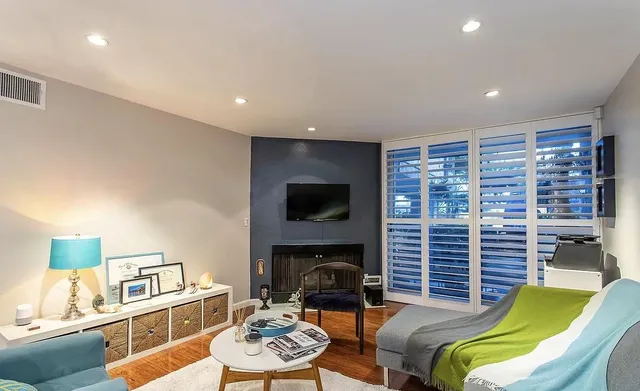 a view of a bedroom with a large window