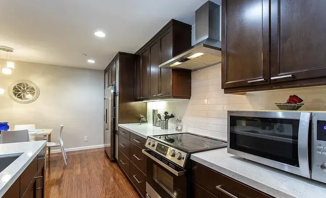 a bathroom with a bathtub shower sink and toilet
