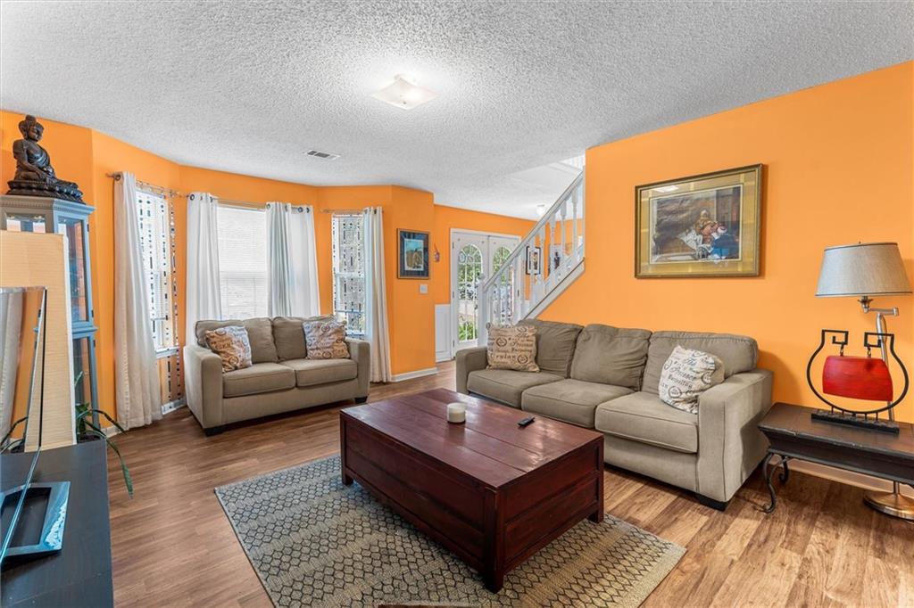 3234 Mineral Ridge Lane Stone Mountain, GA 30087 - Photo 6 of 55 a living room with furniture and a large window