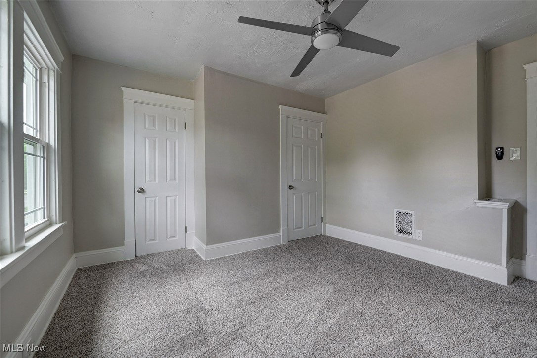 896 Selwyn Road Cleveland Heights, OH 44112 - Photo 15 of 23 Unfurnished bedroom with carpet and ceiling fan