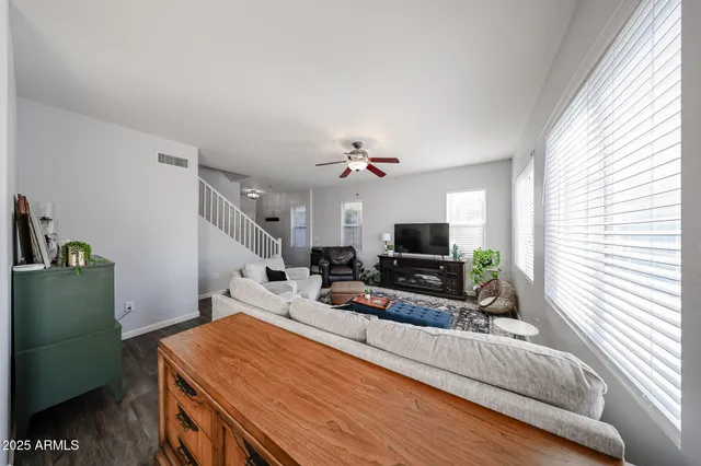 a view of a dining room with furniture window and wooden floor