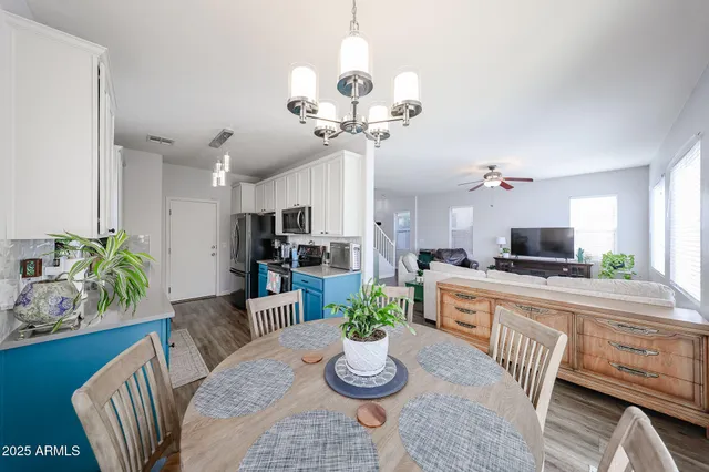 a kitchen with a refrigerator and a sink