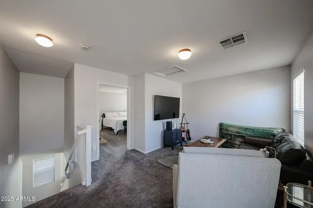 a living room with furniture and a window