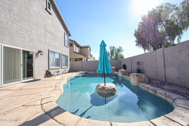 a view of balcony with chairs and potted plants