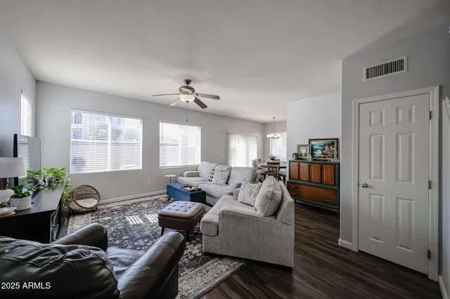 a living room with furniture or couch and a chandelier