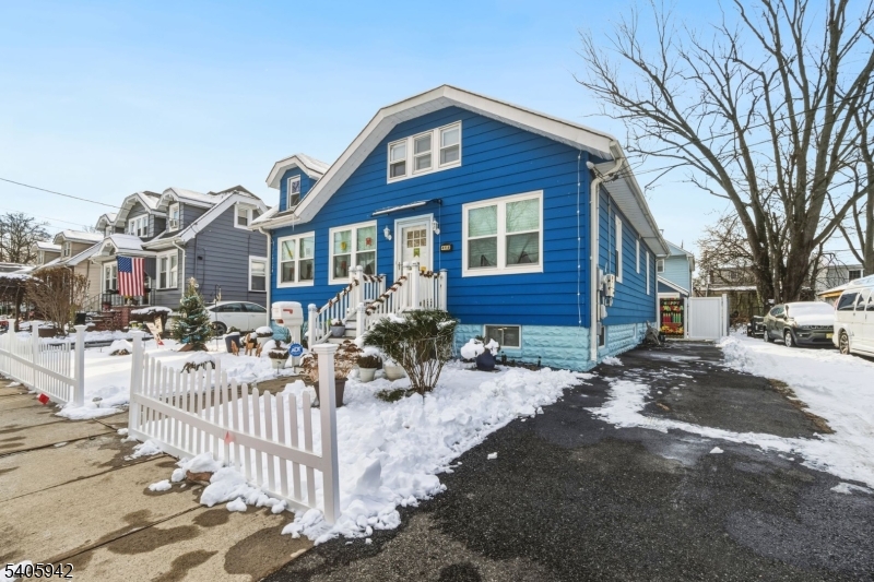 414 Martin Street Roselle, NJ 07203 - Photo 2 of 11 a front view of a house with a yard