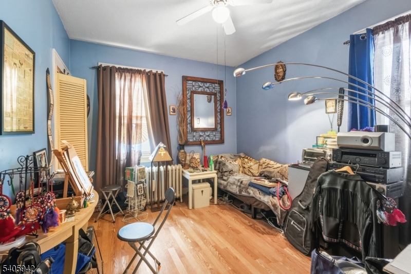 414 Martin Street Roselle, NJ 07203 - Photo 8 of 11 a bed room with two beds and a dresser