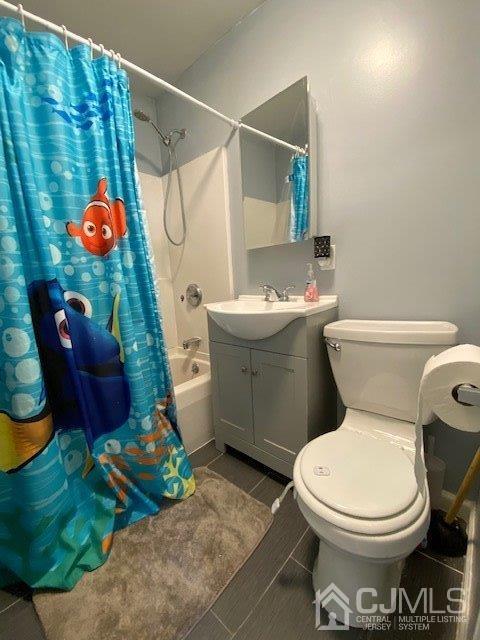 62 Tunison Road New Brunswick, NJ 08901 - Photo 12 of 23 a white toilet sitting next to a bathroom sink and a tub