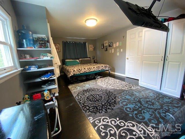 62 Tunison Road New Brunswick, NJ 08901 - Photo 18 of 23 a bedroom with a bed and a window
