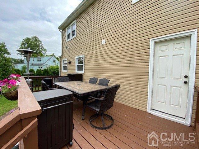 62 Tunison Road New Brunswick, NJ 08901 - Photo 22 of 23 a table and chairs in front of a house