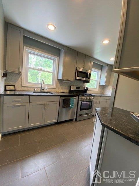 62 Tunison Road New Brunswick, NJ 08901 - Photo 7 of 23 a kitchen with stainless steel appliances granite countertop a sink and a stove