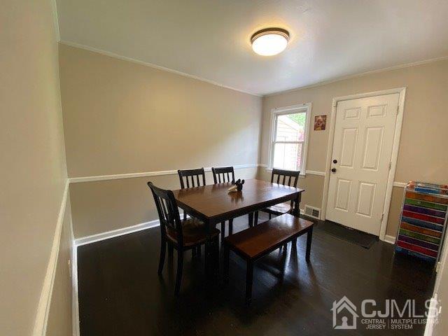 62 Tunison Road New Brunswick, NJ 08901 - Photo 8 of 23 a view of a dining room with furniture and wooden floor