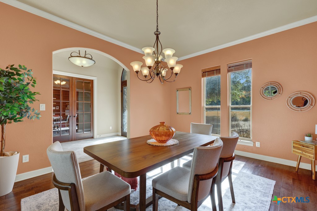 7607 Sky Loop Garden Ridge, TX 78266 - Photo 21 of 43 a view of a dining room with furniture and chandelier