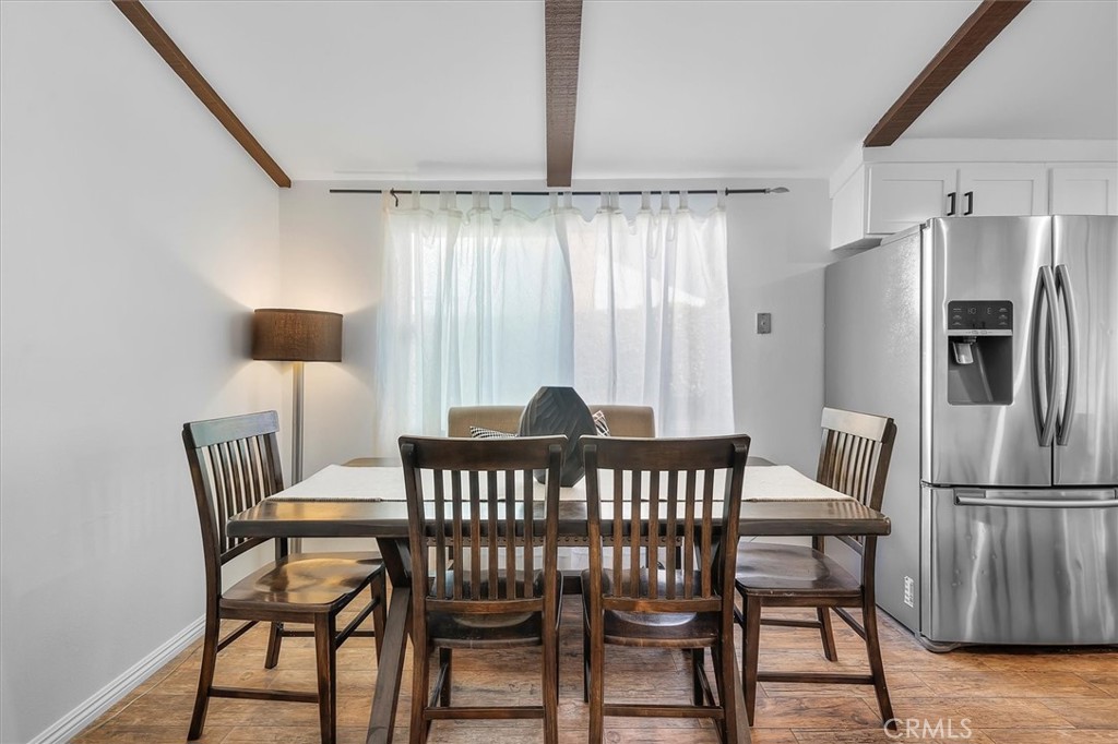 1702 East Dimondale Drive Carson, CA 90746 - Photo 11 of 43 a view of a dining room with furniture window and wooden floor