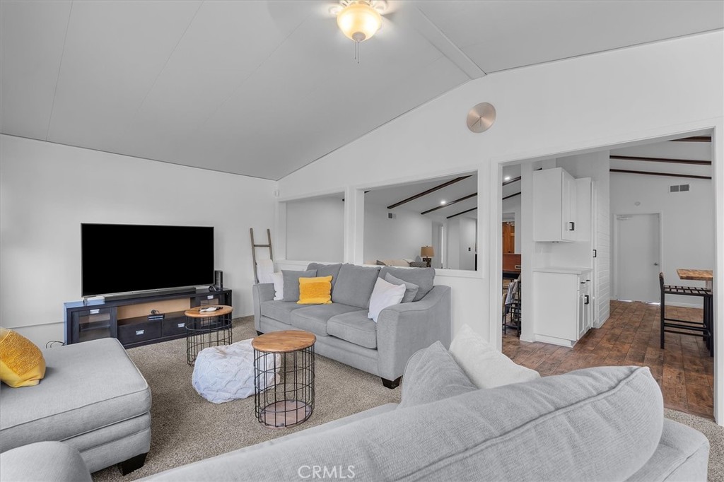 1702 East Dimondale Drive Carson, CA 90746 - Photo 24 of 43 a living room with furniture and a flat screen tv