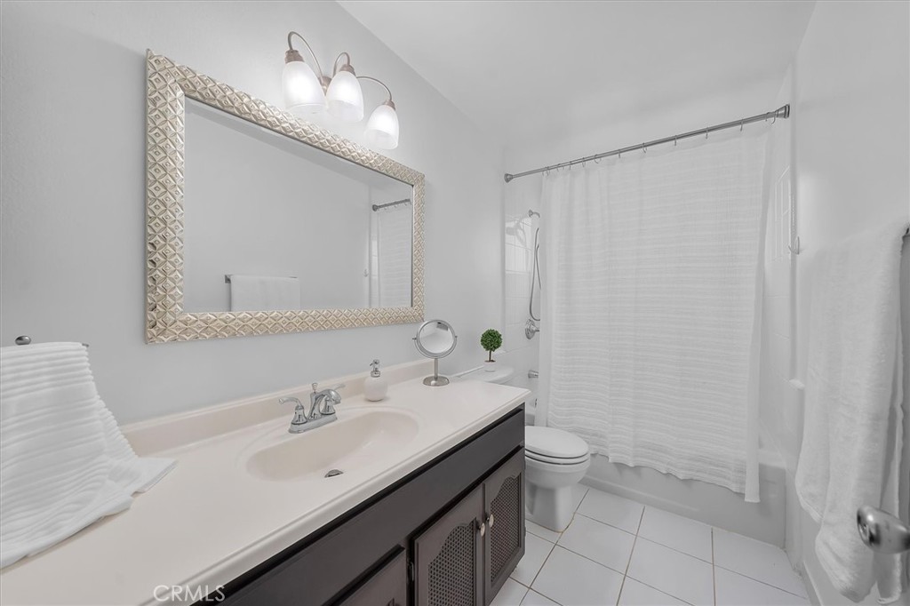 1702 East Dimondale Drive Carson, CA 90746 - Photo 32 of 43 a bathroom with a sink a toilet and a mirror