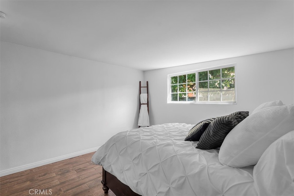 1702 East Dimondale Drive Carson, CA 90746 - Photo 37 of 43 a bedroom with a bed and a window