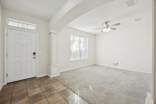 a view of an empty room with a window