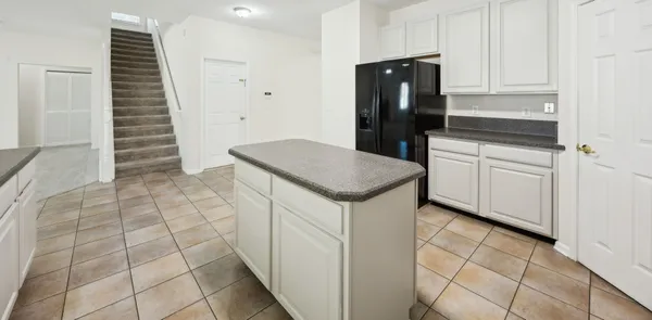 a kitchen with a sink and cabinets