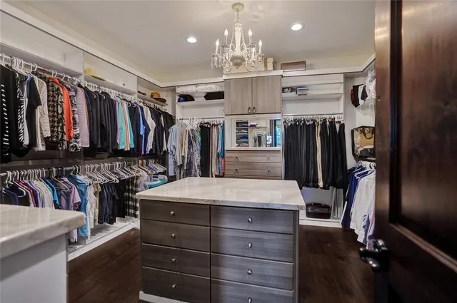 a kitchen with stainless steel appliances a refrigerator and a stove
