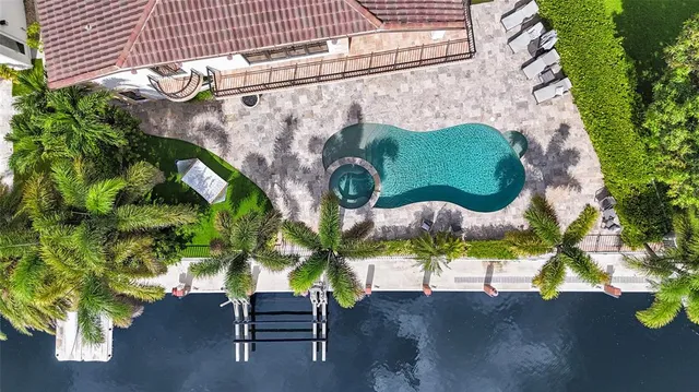 a view of a swimming pool with a patio