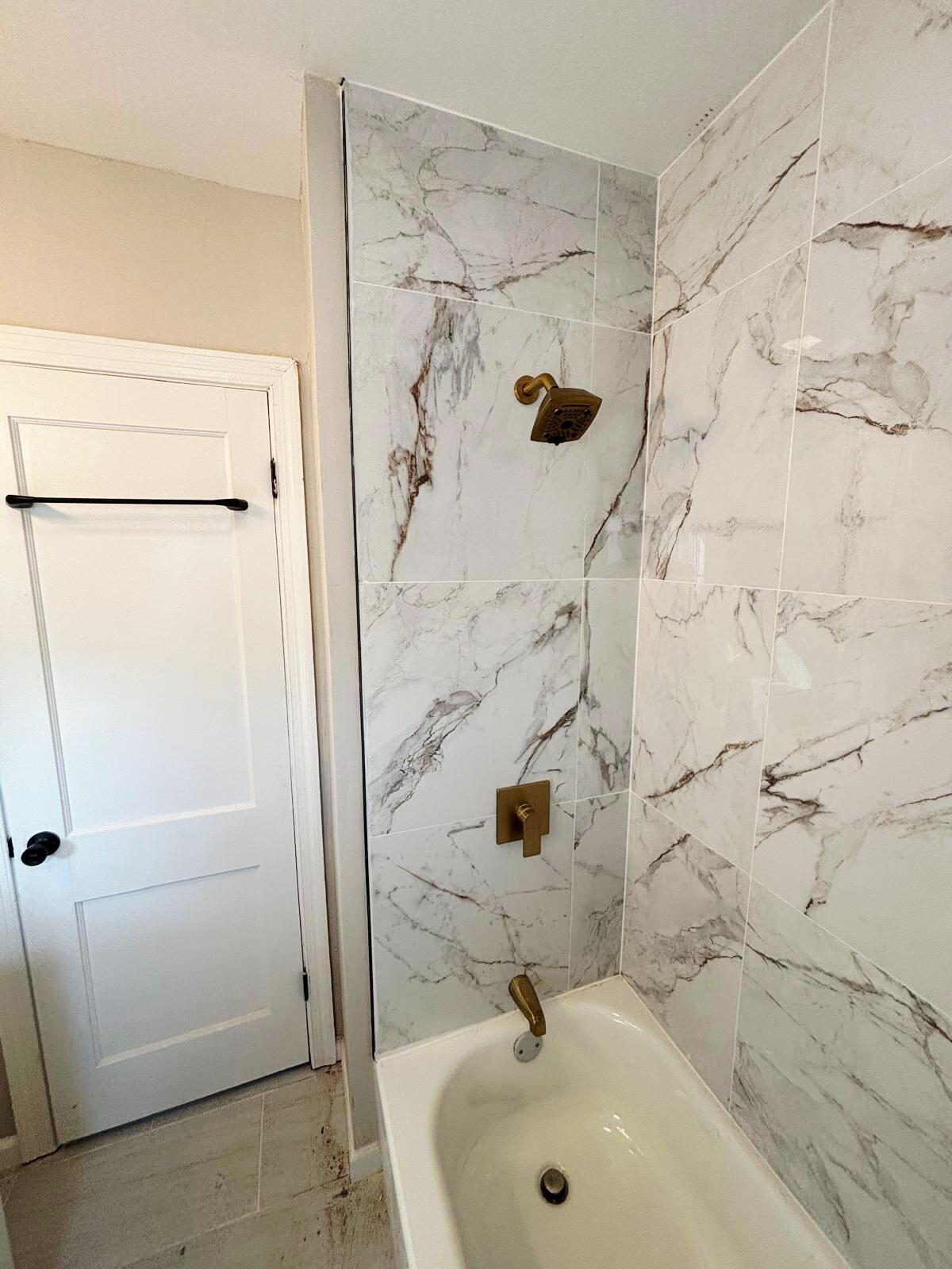 601 Burr Street Gary, IN 46406 - Photo 15 of 24 a bathroom with a sink and a shower
