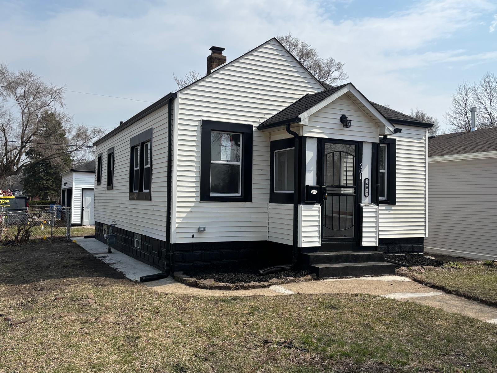 601 Burr Street Gary, IN 46406 - Photo 2 of 24 a view of a house with a yard