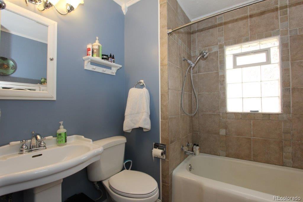508 East Baseline Road Lafayette, CO 80026 - Photo 14 of 35 a bathroom with a sink toilet and shower
