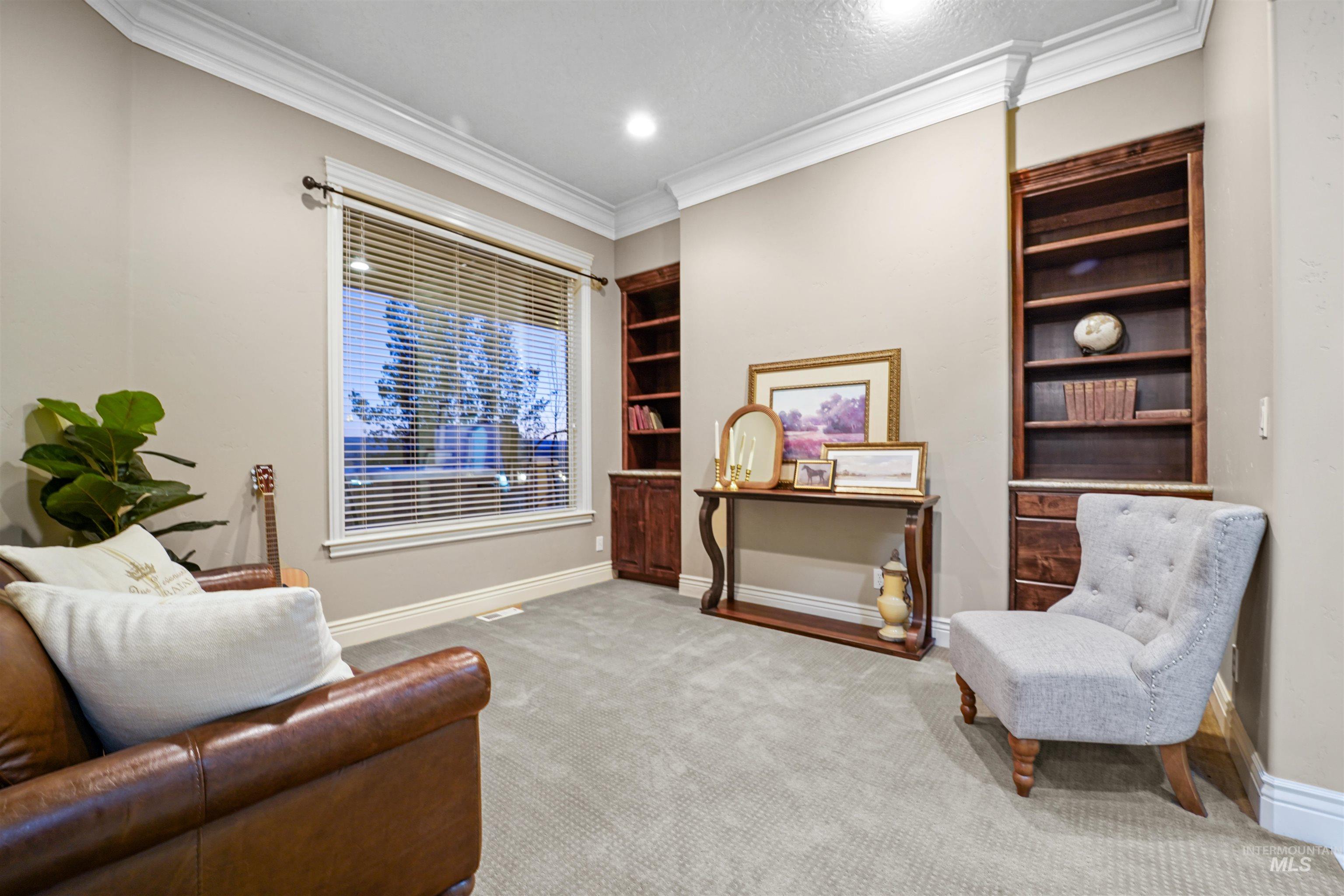 10430 Randall Lane Caldwell, ID 83607 - Photo 16 of 39 Sitting room with crown molding, carpet floors, and built in features