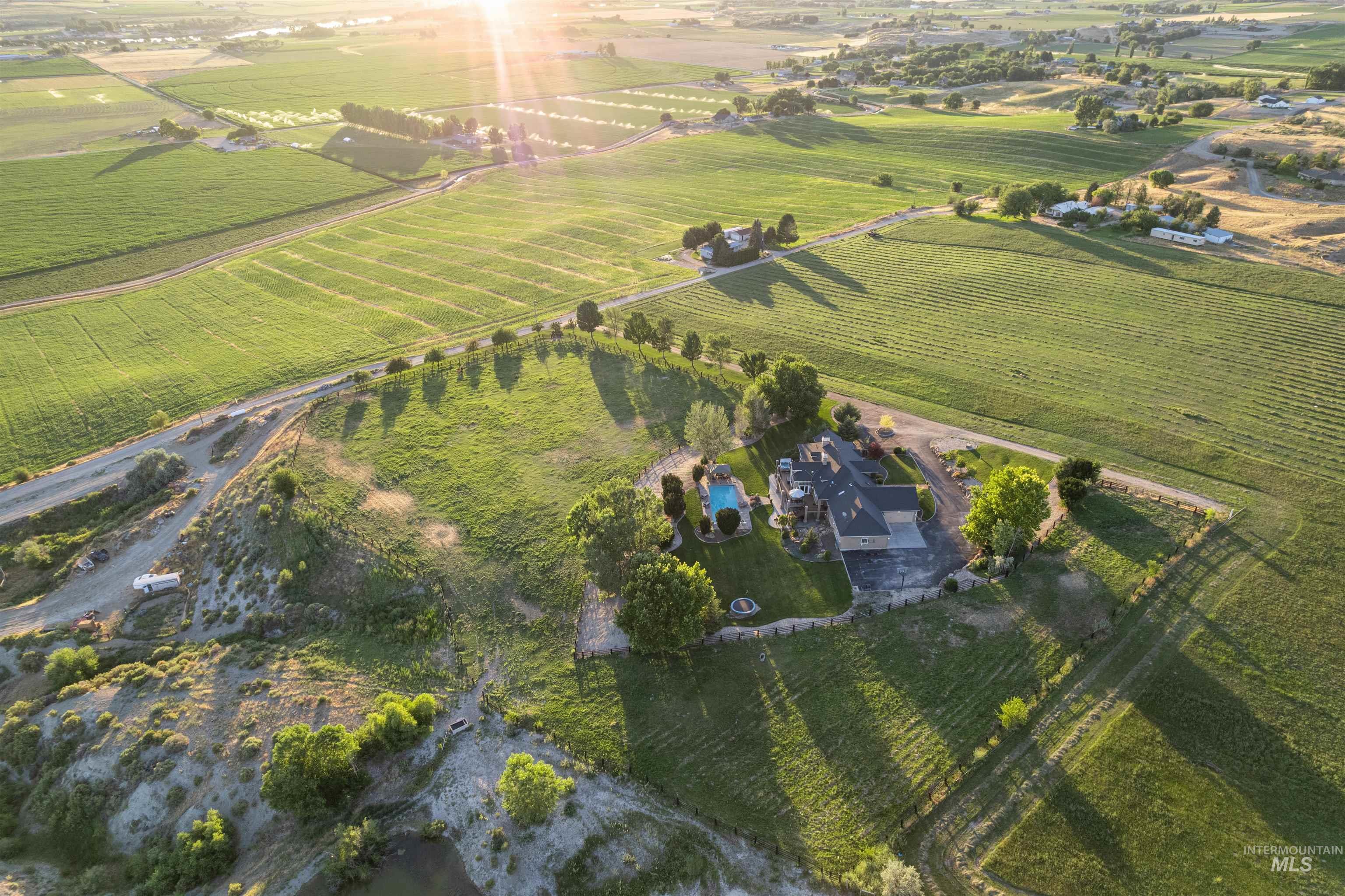 10430 Randall Lane Caldwell, ID 83607 - Photo 25 of 39 Aerial view of property's location featuring rural landscape and rows of crops