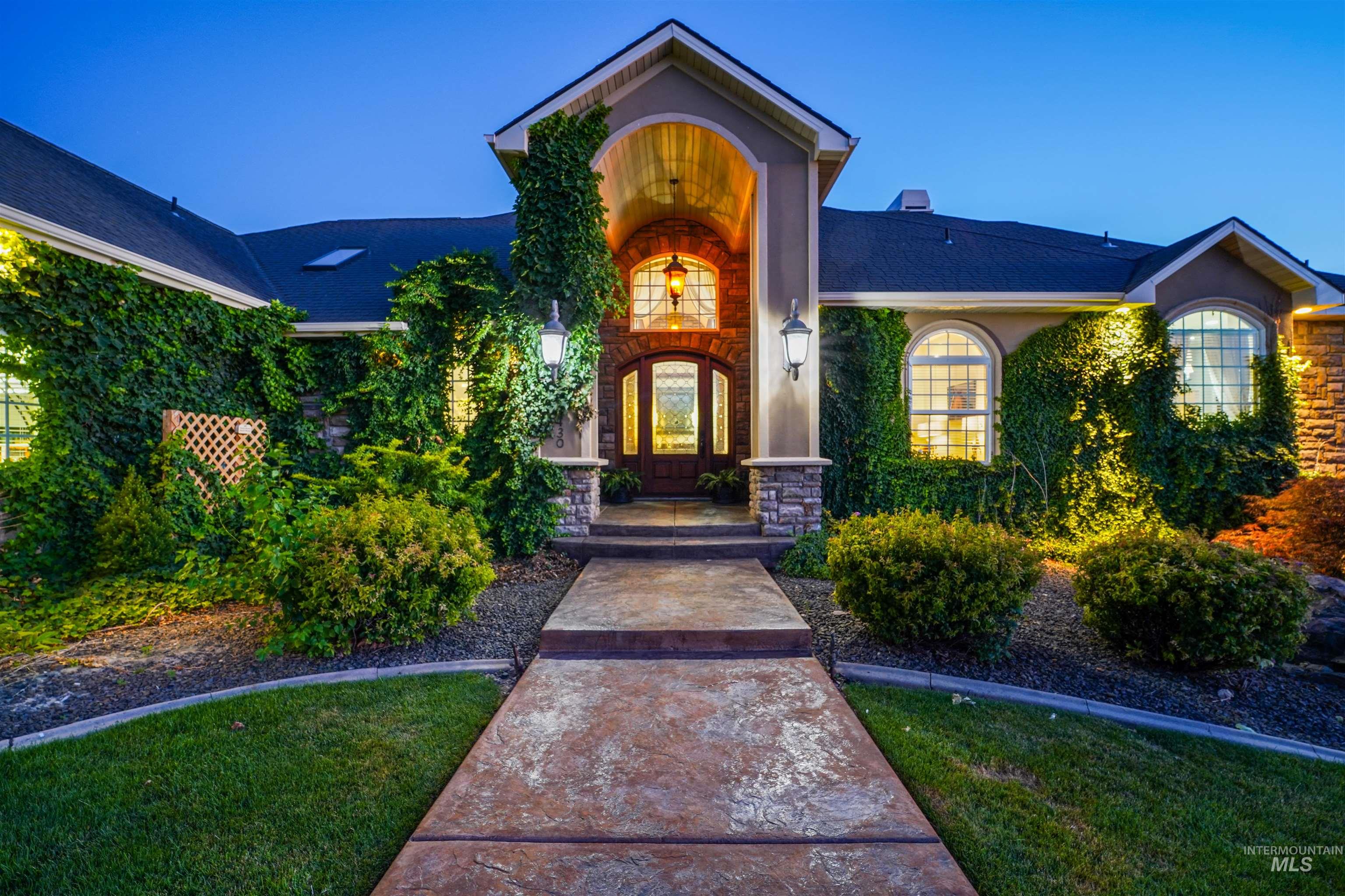 10430 Randall Lane Caldwell, ID 83607 - Photo 4 of 39 Doorway to property featuring roof with shingles