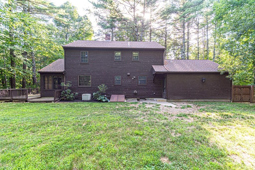 487 Boston Road Groton, MA 01450 - Photo 2 of 32 a front view of a house with a garden
