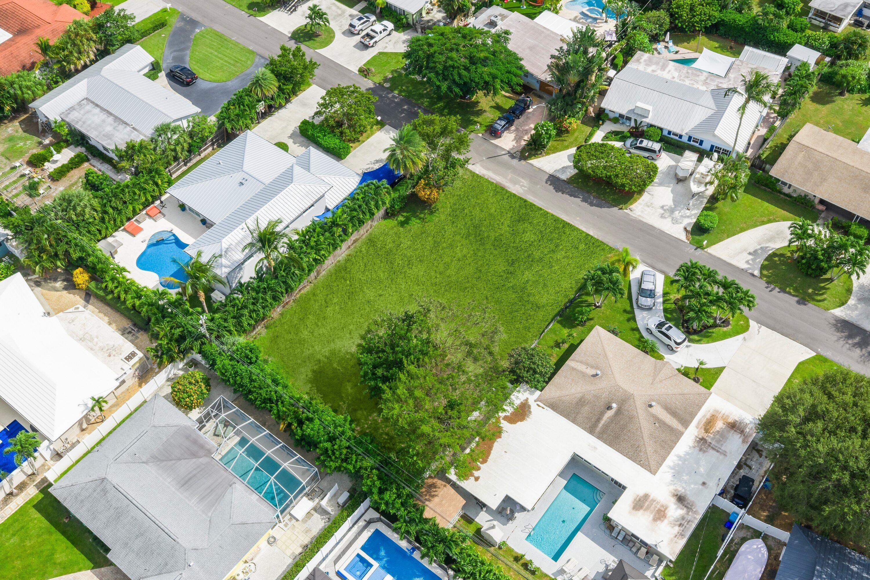 925 Sunset Road Boynton Beach, FL 33435 - Photo 4 of 16 an aerial view of a house with a garden and swimming pool