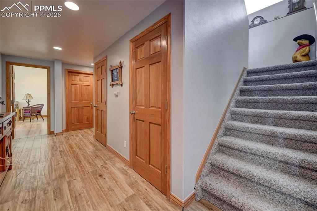 5910 McCart Ranch Circle Elizabeth, CO 80107 - Photo 21 of 50 a view of entryway with wooden floor and stairs