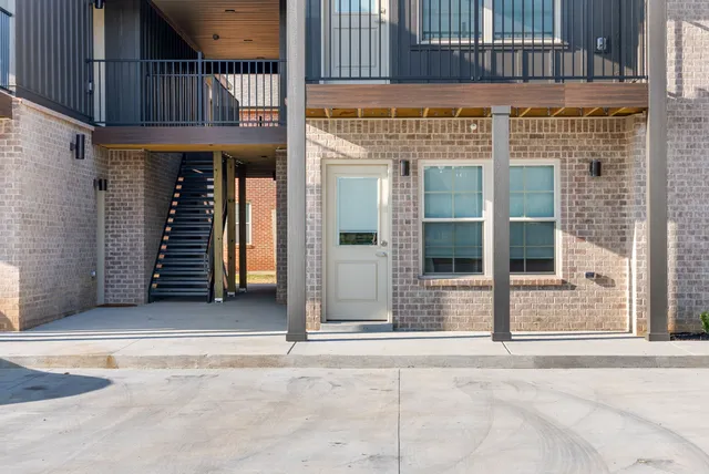a view of a building with a door and a window