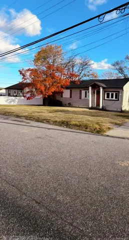 a view of a big house with a big yard