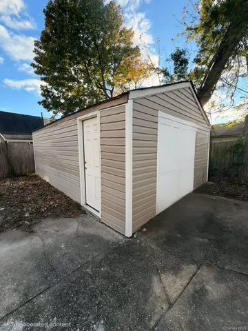 a view of a small house with a backyard