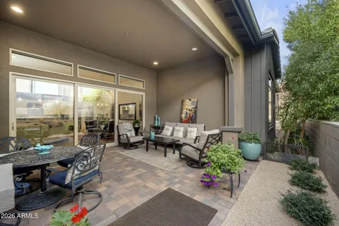 a living room filled with furniture and a potted plant