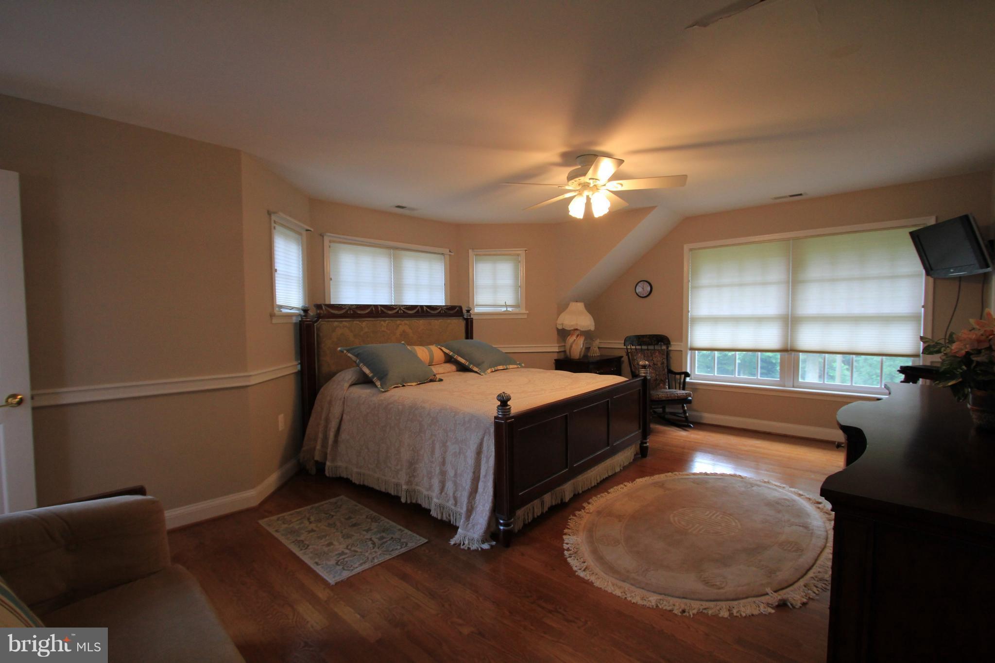 2850 Dunleigh Drive Dunkirk, MD 20754 - Photo 13 of 26 a bed room with a bed and a chandelier