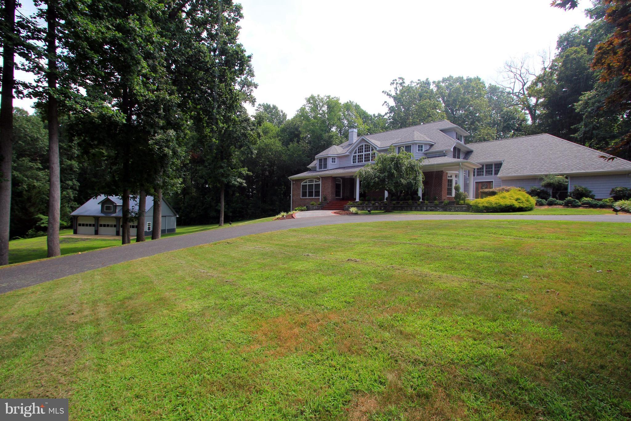 2850 Dunleigh Drive Dunkirk, MD 20754 - Photo 25 of 26 a view of a house with backyard porch and sitting area