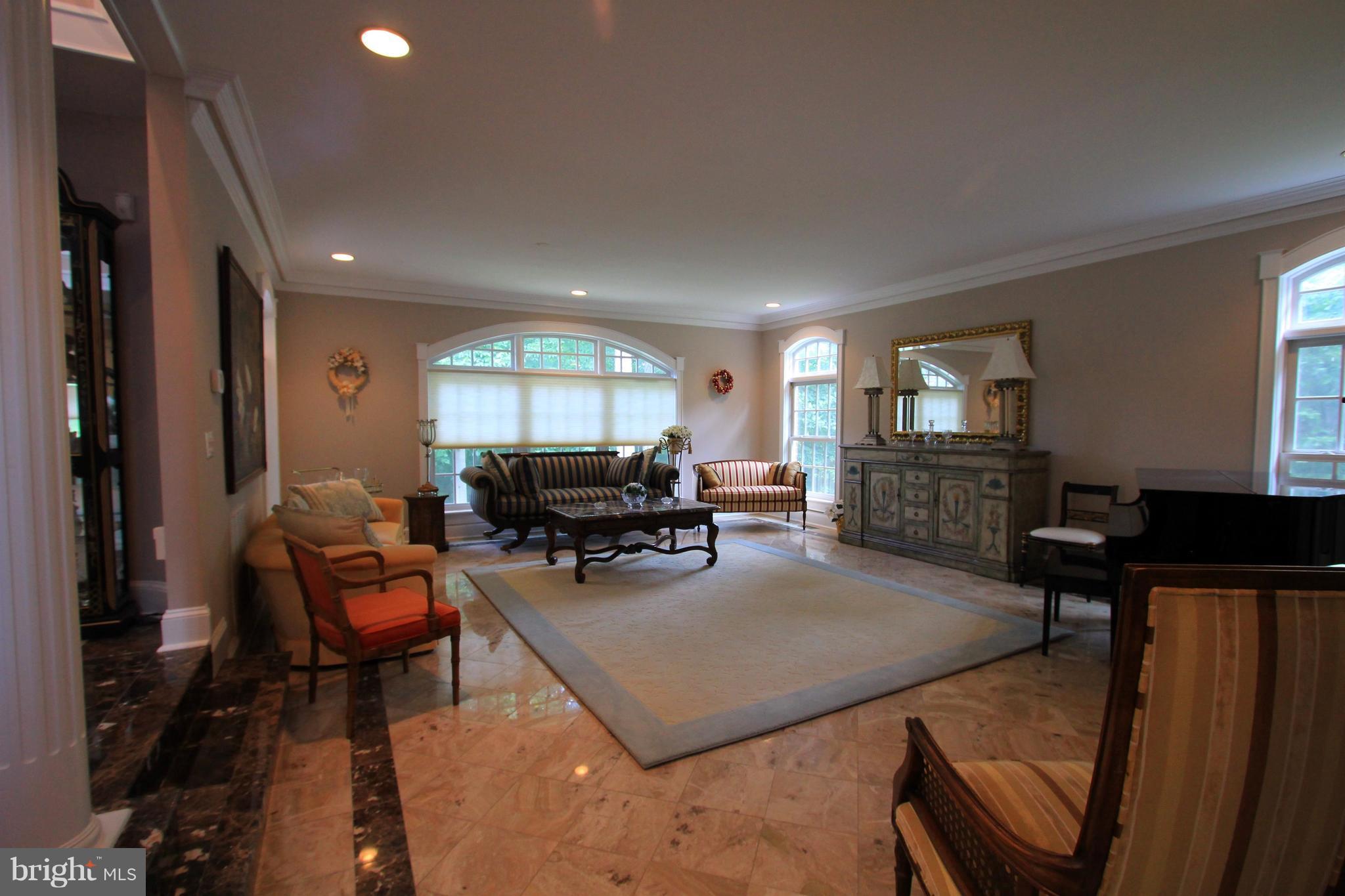 2850 Dunleigh Drive Dunkirk, MD 20754 - Photo 5 of 26 a living room with furniture a large window and glass table