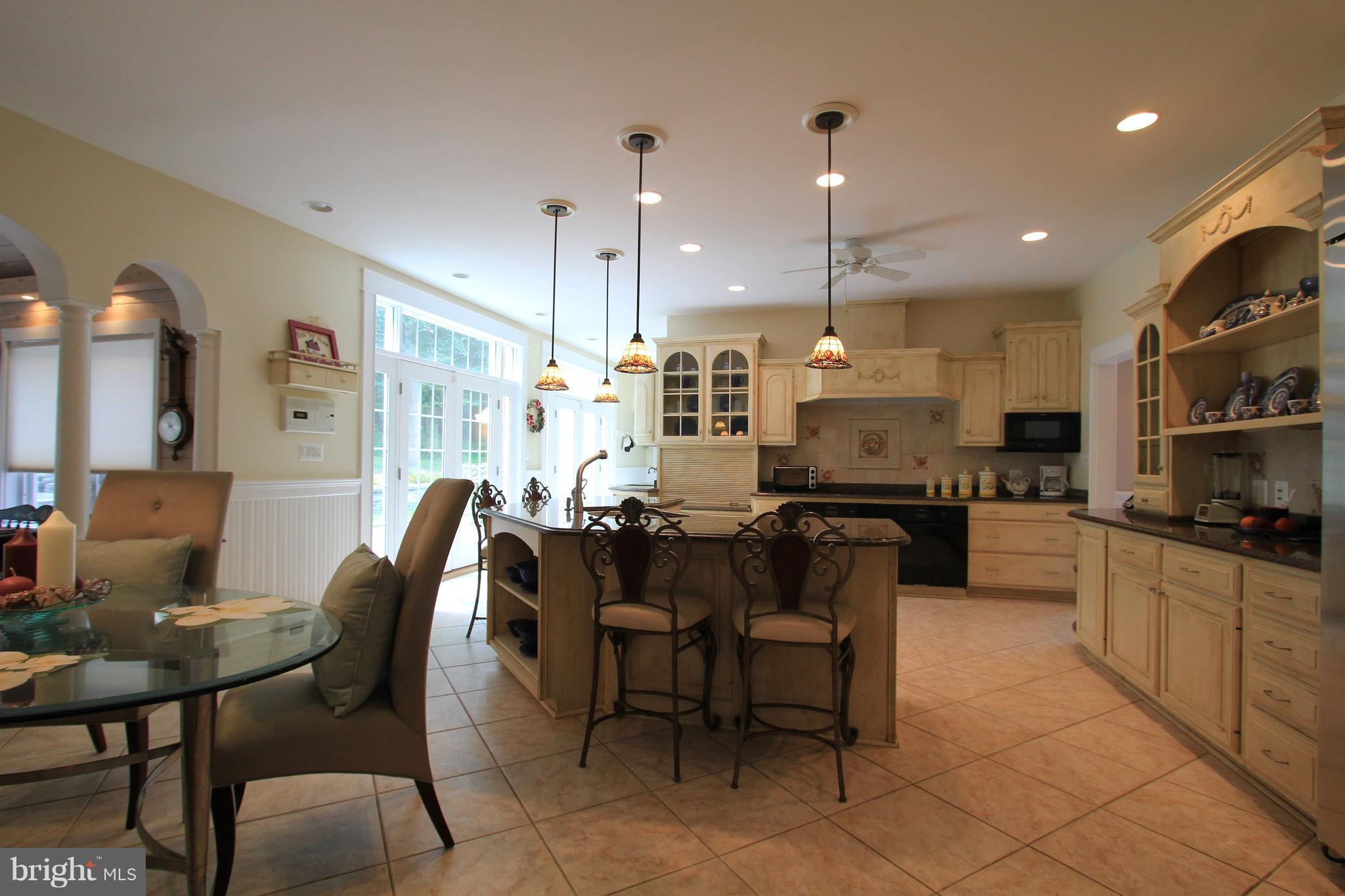 2850 Dunleigh Drive Dunkirk, MD 20754 - Photo 8 of 26 a large kitchen with a table and chairs