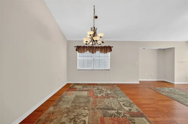 a view of a hallway with a chandelier