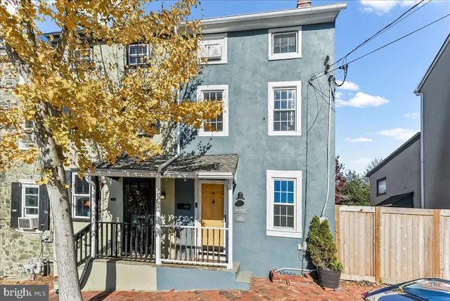 a front view of a house with large windows