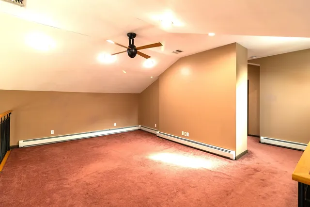 an empty room with a empty space and a ceiling fan
