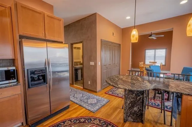 a kitchen with stainless steel appliances a stove sink and cabinets