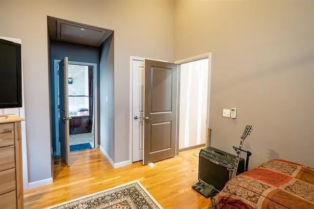a bathroom with a granite countertop sink and a bathtub