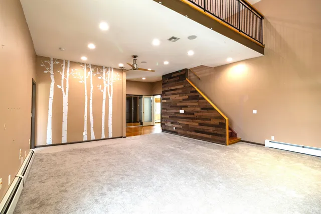 a view of an empty room with stairs
