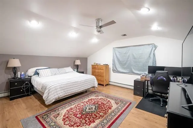 a bathroom with a sink and mirror with toilet